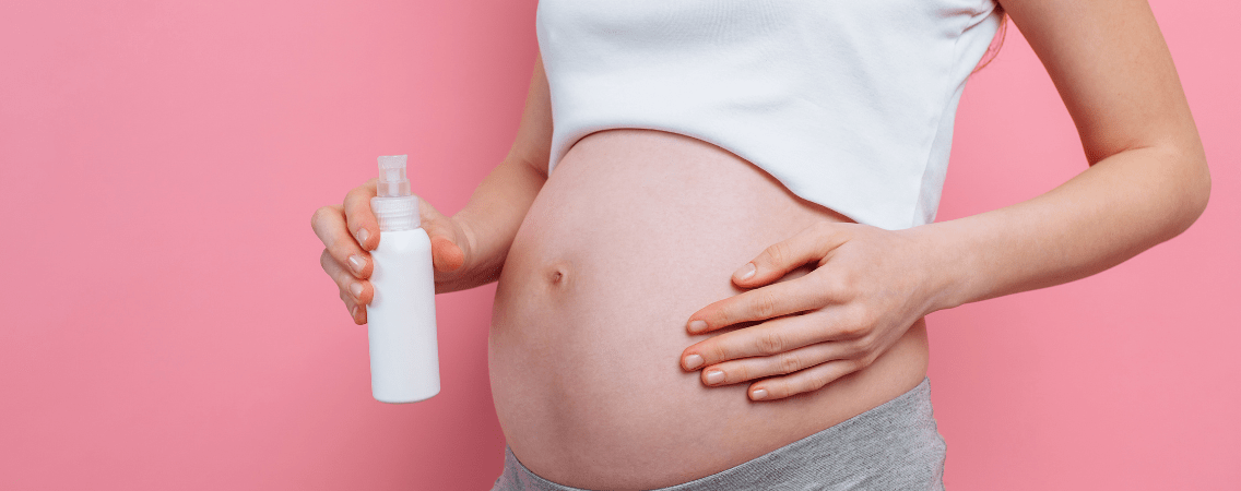 Pregnant women using the best belly oil for stretch mark prevention